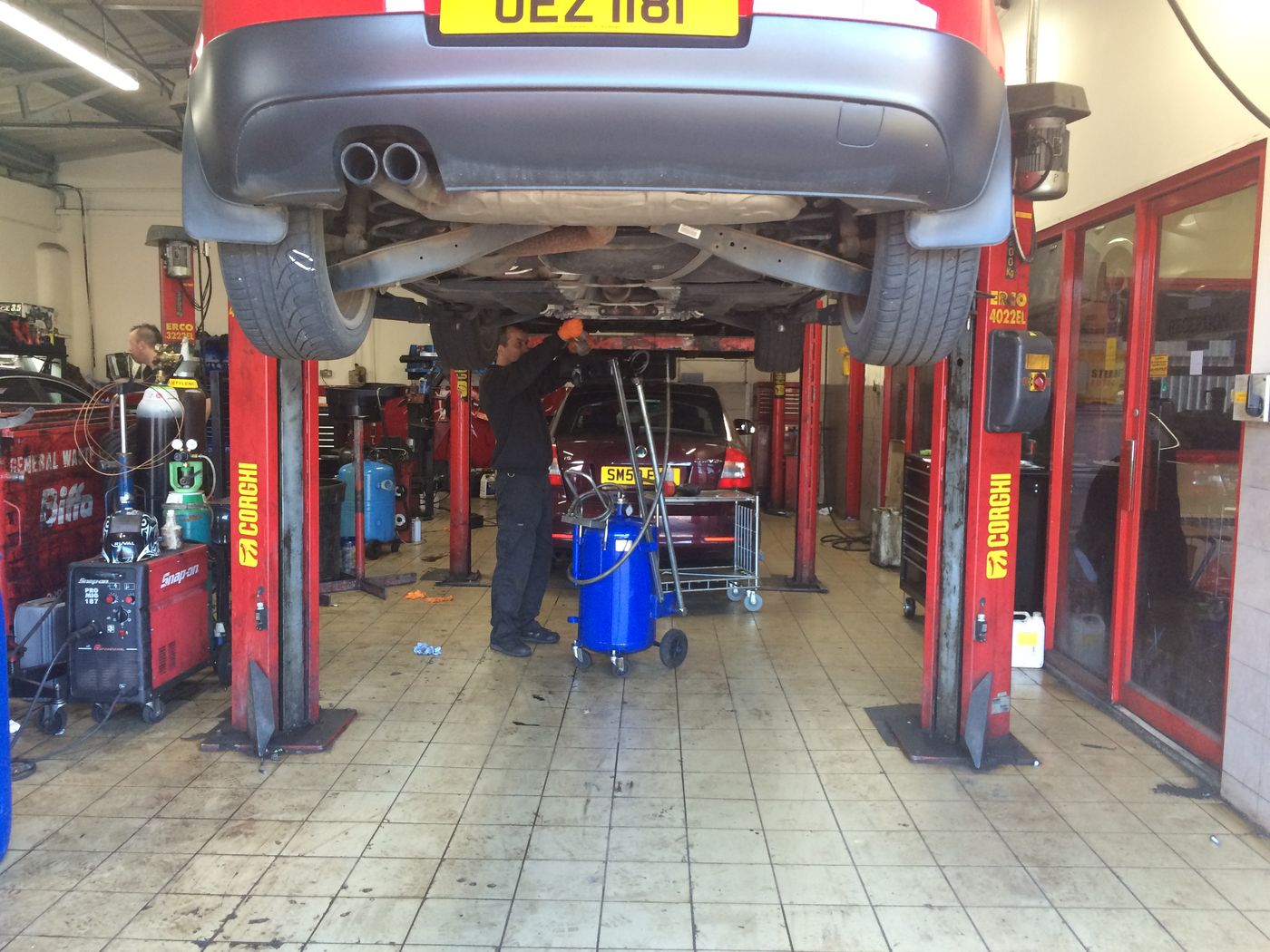 Car on a ramp in the Sterrett's workshop during a service